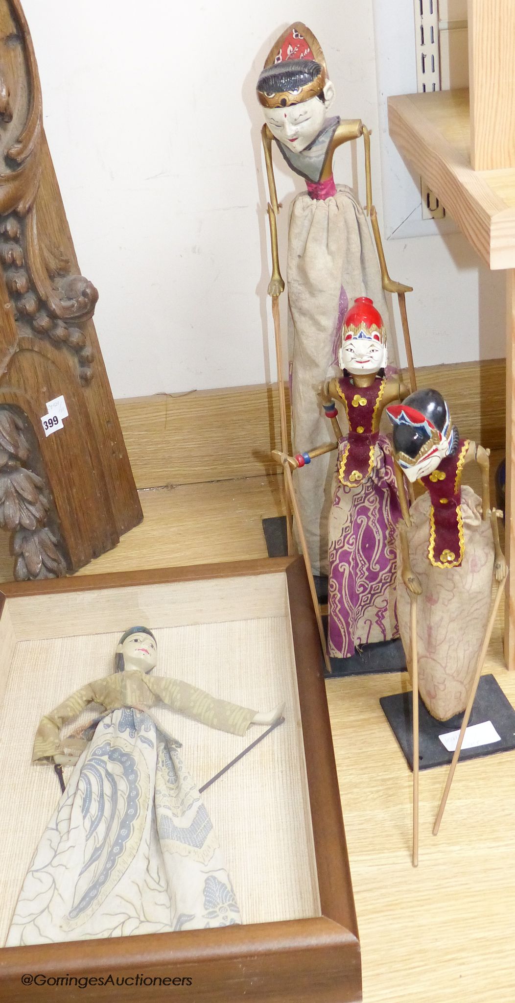 Three Indonesian stick puppets and another framed puppet, tallest 59cm
